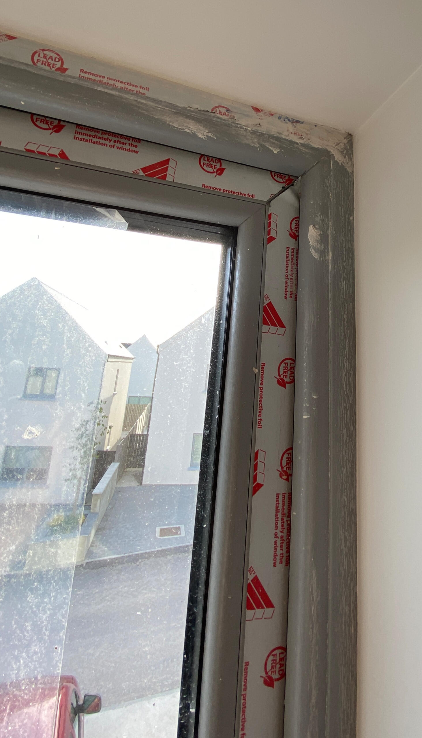 Window protective film covered in plaster, Rosscarbery.