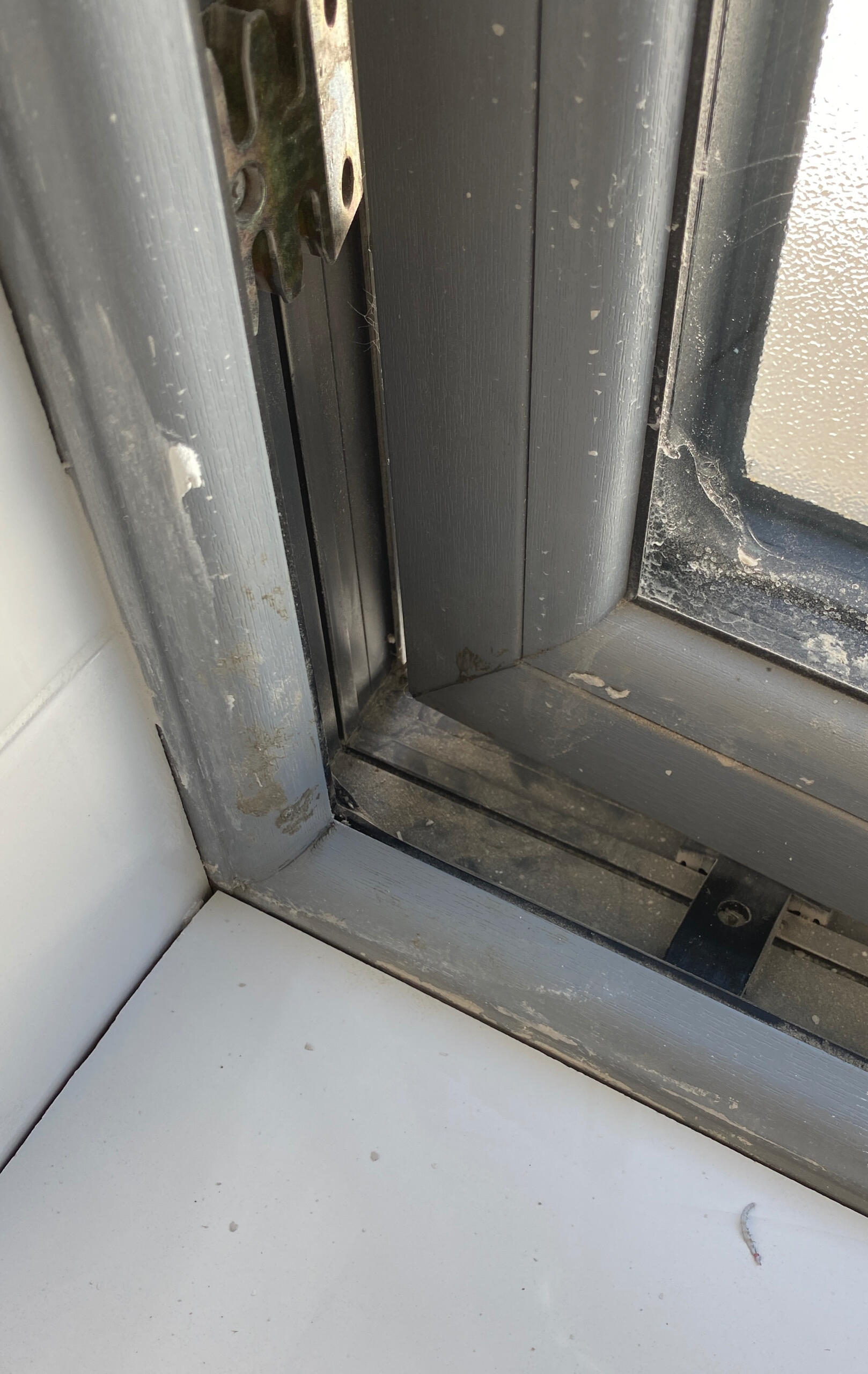 New window covered in plaster, dust and sticky residue, Rosscarbery.